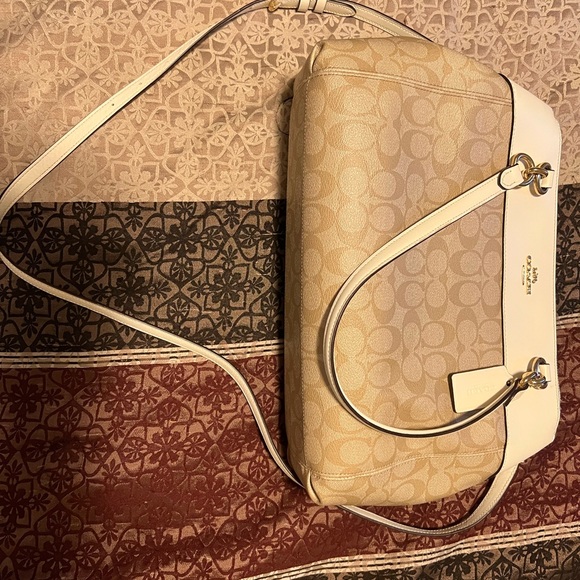 Coach Handbags - Tan and white coach purse. Good condition. Used. Gold starting to come off rings